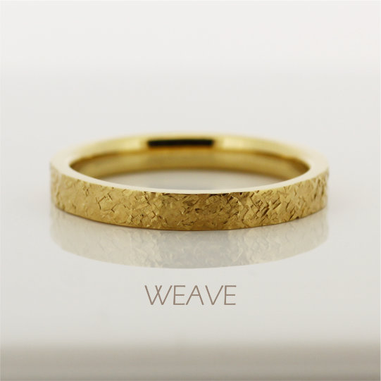 織り込まれた模様のAU999(k24)純金の指輪の画像